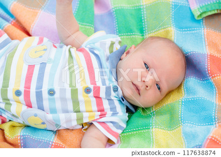 Little baby on colorful blanket 117638874