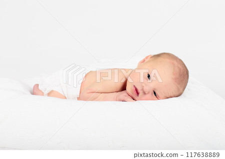 Newborn baby boy in hospital cot 117638889