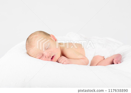 Newborn baby boy in hospital cot Newborn baby boy in hospital cot 117638890