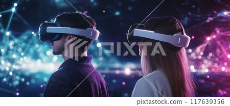 Two individuals exploring virtual reality in a vibrant digital environment at night 117639356