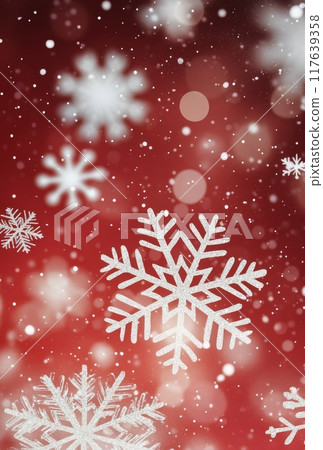 Snowflakes falling on a red background during winter celebrations 117639358