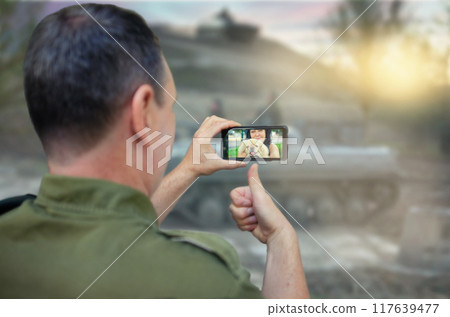 Pixels of Hope: Military Officer's Video Call Brings Home Closer During Intense Training Operations. 117639477