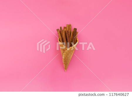 cinnamon sticks in a waffle ice cream cone 117640627