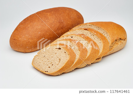 Whole wheat bread loaf sliced, showcasing its hearty texture and rich, wholesome flavor 117641461