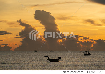 Fishing boats are floating over the sea in golden hours. Fishing boats are floating over the sea in golden hours. 117642178