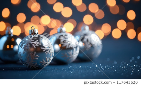 A group of silver Christmas ornaments with snowflakes on them A group of silver Christmas ornaments with snowflakes on them 117643620