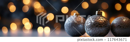 Three silver ornaments are sitting on a table Three silver ornaments are sitting on a table 117643671