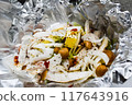 Shimeji mushrooms and butter baked in foil 117643916