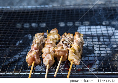 Grilled chicken on a grill 117643918