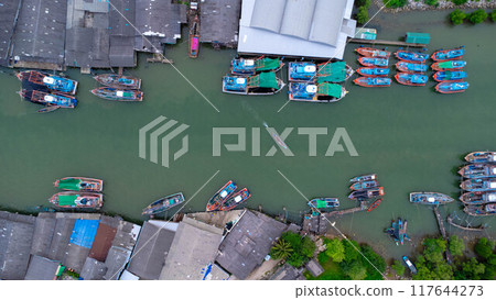 Aerial view of fishing village and gulf at Pak Nam Sichon, estuary area in Chumphon Province, Thailand. Aerial view of fishing village and gulf at Pak Nam Sichon, estuary area in Chumphon Province, Thailand. 117644273