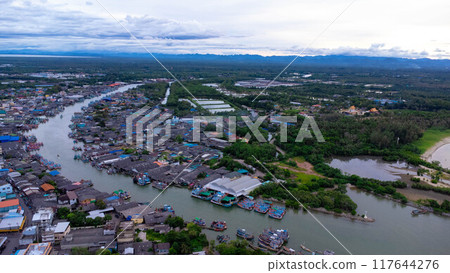 Aerial view of fishing village and gulf at Pak Nam Sichon, estuary area in Chumphon Province, Thailand. Aerial view of fishing village and gulf at Pak Nam Sichon, estuary area in Chumphon Province, Thailand. 117644276