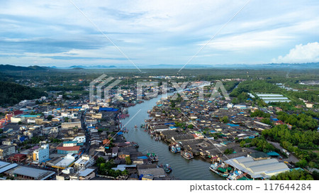 Aerial view of fishing village and gulf at Pak Nam Sichon, estuary area in Chumphon Province, Thailand. Aerial view of fishing village and gulf at Pak Nam Sichon, estuary area in Chumphon Province, Thailand. 117644284