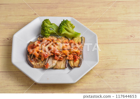 Grilled eggplant with tomato sauce and cheese Grilled eggplant with tomato sauce and cheese 117644653