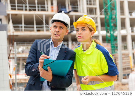 Civil engineers checking work process in construction site Civil engineers checking work process in construction site 117645139