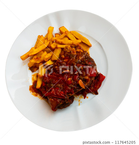 Lunch served on plate - pork chop with vegetable ragout samfain sauce and French fries 117645205