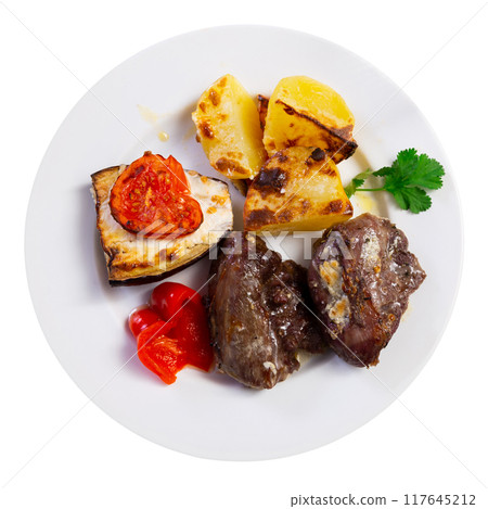 Baked pork cheek served with vegetables Baked pork cheek served with vegetables 117645212