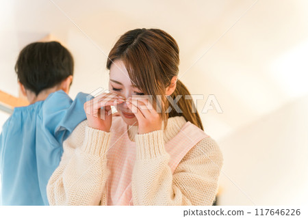 A young nursery school teacher crying and feeling stressed because of her busy and hard work 117646226