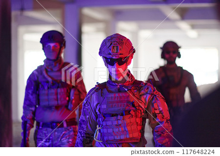 Soldier squad team walking in urban environment colored lightis 117648224