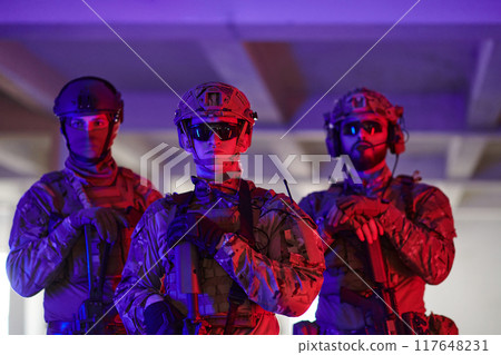 Soldier squad team walking in urban environment colored lightis 117648231