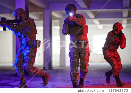 A group of professional soldiers bravely executes a dangerous rescue mission, surrounded by fire in a perilous building. A group of professional soldiers bravely executes a dangerous rescue mission, surrounded by fire in a perilous building. 117648270