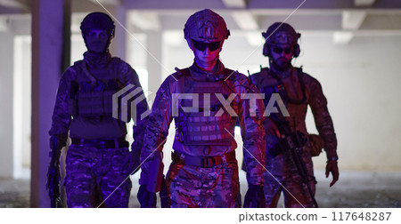 Soldier squad team walking in urban environment colored lightis 117648287