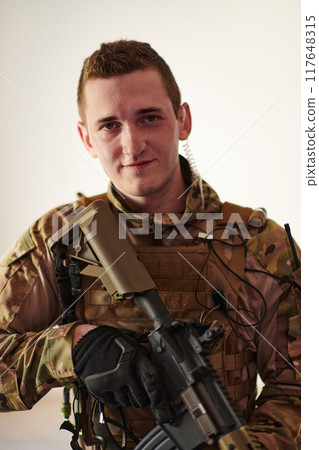 Modern warfare soldier portrait in urban environment Modern warfare soldier portrait in urban environment 117648315