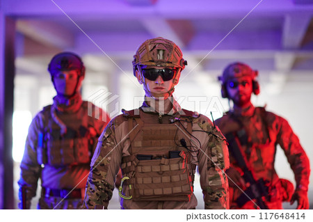 Soldier squad team walking in urban environment colored lightis Soldier squad team walking in urban environment colored lightis 117648414