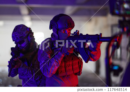 A professional cameraman captures the intense moments as a group of skilled soldiers embarks on a dangerous mission inside an abandoned building, their actions filled with suspense and bravery 117648514