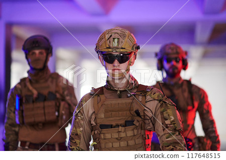 Soldier squad team walking in urban environment colored lightis 117648515