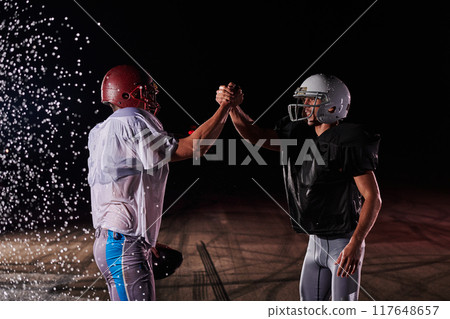 Two american football players face to face in silhouette shadow on white background 117648657