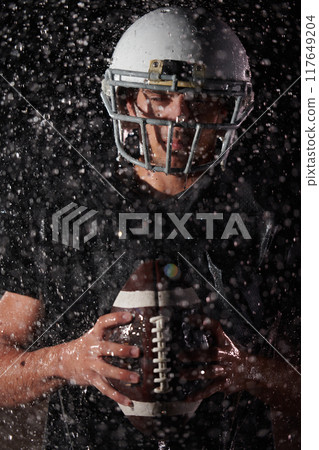 American Football Field: Lonely Athlete Warrior Standing on a Field Holds his Helmet and Ready to Play. Player Preparing to Run, Attack and Score Touchdown. Rainy Night with Dramatic Fog, Blue Light American Football Field: Lonely Athlete Warrior Standing on a Field Holds his Helmet and Ready to Play. Player Preparing to Run, Attack and Score Touchdown. Rainy Night with Dramatic Fog, Blue Light 117649204
