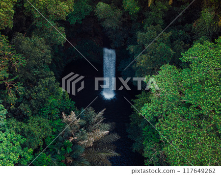 Waterfall in rain forest. Aerial drone view of Tibumana waterfall Waterfall in rain forest. Aerial drone view of Tibumana waterfall 117649262