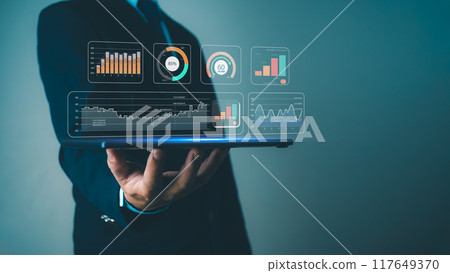 Businessman show tablet to analyze business and manage corporate data, Business analytics with charts, metrics and KPIs to improve organizational performance, Marketing and financial strategy. 117649370