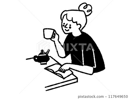 A woman reading a book while drinking coffee_2 117649650