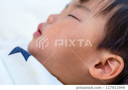 Close-up of a 2-year-old child sleeping 117652949