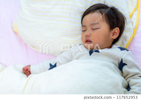 Close-up of a 2-year-old child sleeping Close-up of a 2-year-old child sleeping 117652953