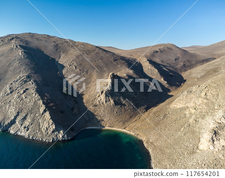 Lake Baikal. Angel Rock. Warm autumn days. 117654201