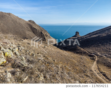 Lake Baikal. Angel Rock. Warm autumn days. 117654211