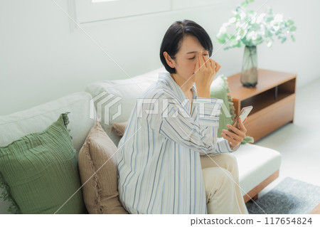 A middle-aged woman in poor health A middle-aged woman in poor health 117654824