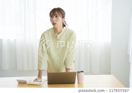 Young woman preparing to start a business in the office Young woman preparing to start a business in the office 117655567