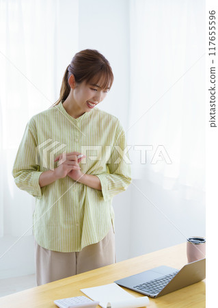 Young woman preparing to start a business in the office 117655596