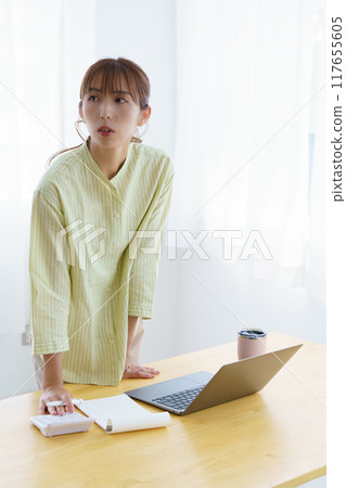 Young woman preparing to start a business in the office Young woman preparing to start a business in the office 117655605