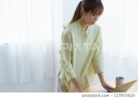 Young woman preparing to start a business in the office 117655620