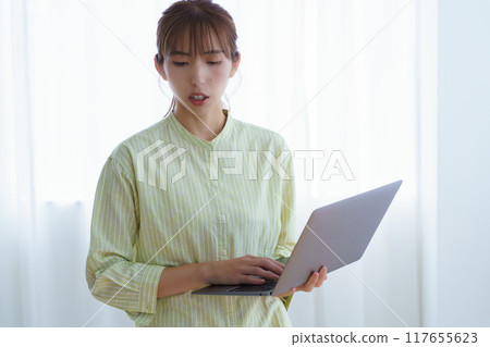 Young woman preparing to start a business in the office Young woman preparing to start a business in the office 117655623