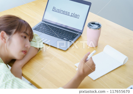 Young woman preparing to start a business in the office 117655670