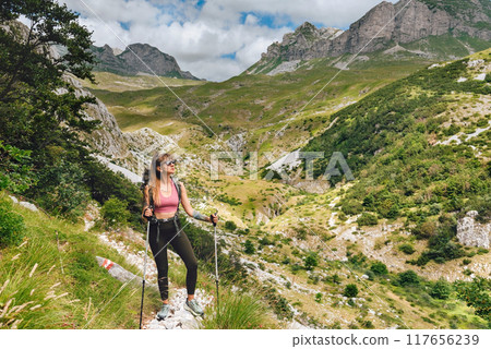 Young Woman Hiker on Rocky Mountain Trail Young Woman Hiker on Rocky Mountain Trail 117656239
