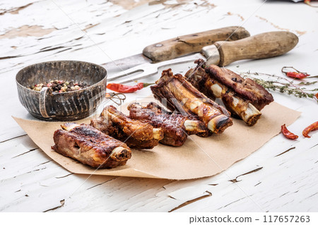 Pork ribs on the white table 117657263