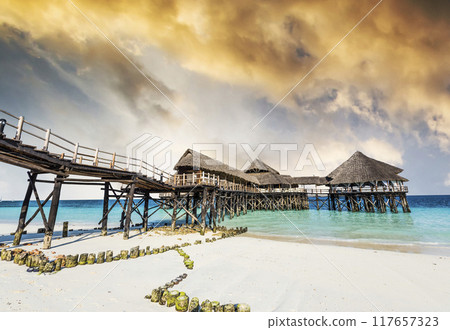 landscape with african hotel in sea on the pier, Zanzibar 117657323