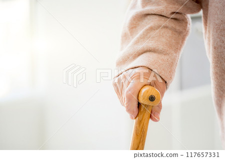 Aged hand with cane Aged hand with cane 117657331