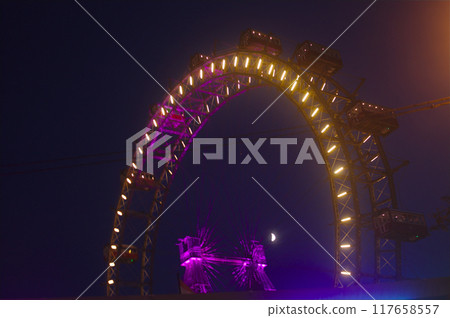 Prater amusement park, Wien - aug 2019: entrance hall and panoramic wheel Prater amusement park, Wien - aug 2019: entrance hall and panoramic wheel 117658557